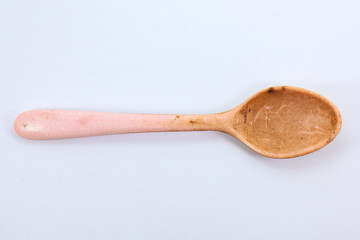 dirty plastic spoon top view isolated on white background