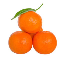 Pyramid of ripe orange mandarins with green leaf isolated on white background
