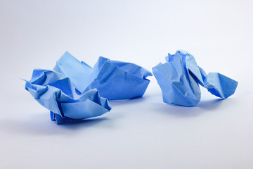 crumpled blue paper ball isolated on white background