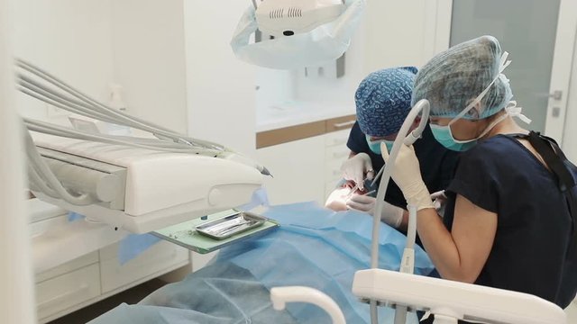 Dentist making anesthesia to his patient