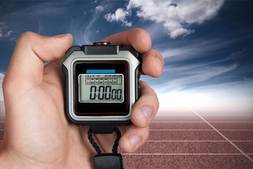 Stopwatch in Human Hand, sport concept