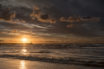 Sunset in Leba sun, mole and lighthouse, Poland