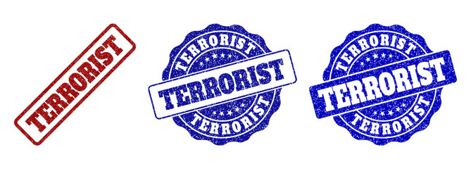 Obraz premium TERRORIST grunge stamp seals in red and blue colors. Vector TERRORIST marks with grunge surface. Graphic elements are rounded rectangles, rosettes, circles and text tags.