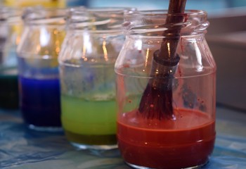 Ebru paint and Ebru brush. The process of creating a picture in the technique of Ebru. Marmaris. Turkey