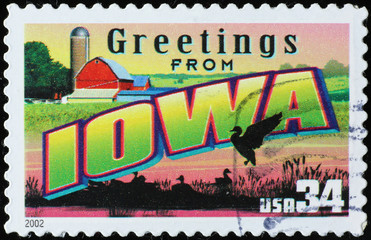 Greetings from Iowa postcard on postage stamp