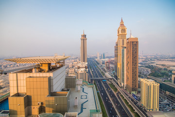 Naklejka na ściany i meble DUBAI, UAE - October, 2018. Dubai skyline in sunset time, United Arab Emirates