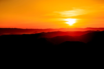 Black and Orange Sunset over Mountains