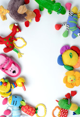 Baby toys frame. Colorful kids toys on white background. Copy space for text. Top view. Flat lay.