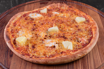 Pizza, food, vegetable, margarita.  Vegetables, mushrooms and tomatoes pizza on a black wooden background. It can be used as a background