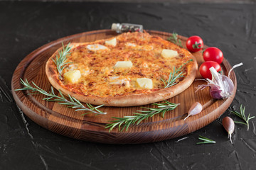 Pizza, food, vegetable, margarita.  Vegetables, mushrooms and tomatoes pizza on a black wooden background. It can be used as a background