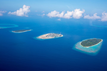 Aerial of the beautiful Maldives, looking down at some stunning islands and atolls