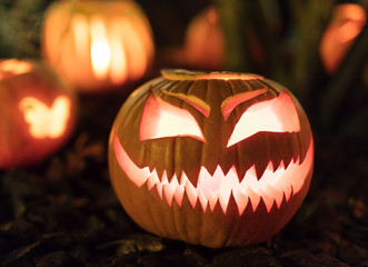 Illuminated figures made of pumpkins. Helloween night.