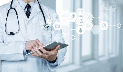 Doctor at hospital working with tablet pc
