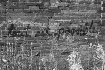 "It is Possible" on a brick wall