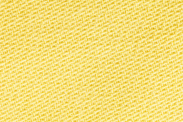 Yellow linen fabric of cloth texture background. Detail of textile material close-up.