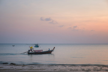 Evening seascape in Thailand with fishing boats