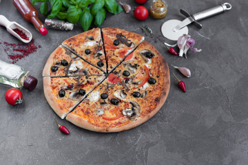 Pizza, food, vegetable, mushrooms.  Vegetables, mushrooms and tomatoes pizza on a black wooden background. It can be used as a background