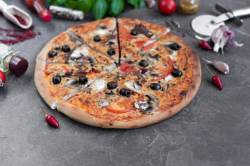 Pizza, food, vegetable, mushrooms.  Vegetables, mushrooms and tomatoes pizza on a black wooden background. It can be used as a background