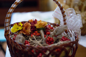 flowers and berries in a basket