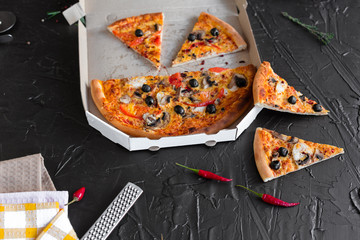 Pizza, food, vegetable, mushrooms.  Vegetables, mushrooms and tomatoes pizza on a black wooden background. It can be used as a background