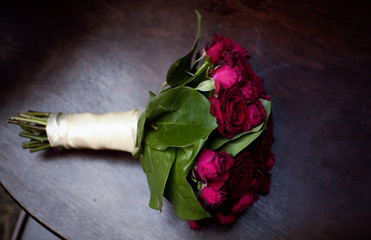 rose in vase on black background