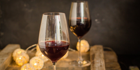 wine, red wine, transparent glass on a wooden table, a gift. Top view. copy space
