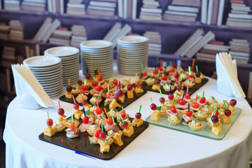 the buffet at the reception. Assortment of canapes.