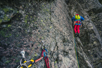 Alpine climbing adventure. A climber or an alpinist ascending big wall in High Tatras, Slovakia....