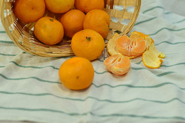 Orange tangerines on a white towel. Orange tangerines. Juicy fruit. Citrus.