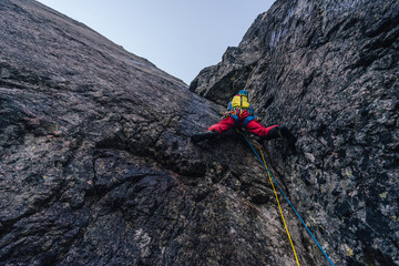 Alpine climbing adventure. A climber or an alpinist ascending big wall in High Tatras, Slovakia....