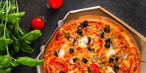 pizza, mushrooms, olives, chicken, tomato sauce, cheese, (pizza ingredients). hot pizza. Top view. copy space