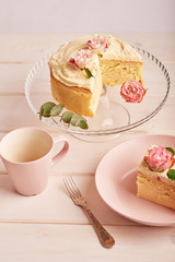 naked cake with roses on white background