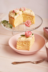 naked cake with roses on white background