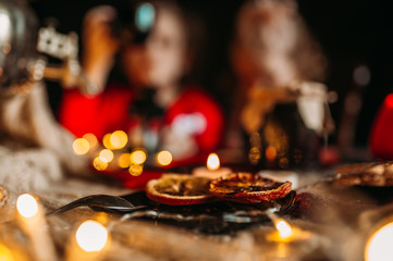 Kids drinking tea at the Christmas table.