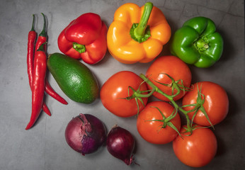 pepper chilli pepper tomato onion avocado on kichen table