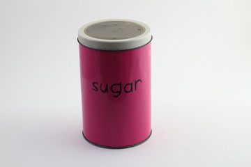 Colorful pink tin storage container on floral pattern