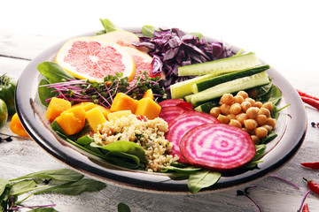 Bowl of Buddha, The concept of a healthy diet: chickpeas, salad, beetroot, pumpkin, cucumber, grapefruit, cabbage and tabouleh. Balanced food.