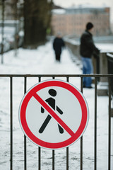 traffic sign prohibiting pedestrian traffic. violation of a road sign is forbidden to people. in...