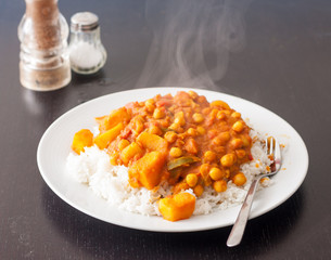 Potato and chickpea vegetable curry served on top of steamed basmati rice