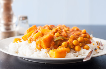 Potato and chickpea vegetable curry served on top of steamed basmati rice