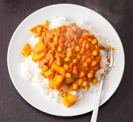 Potato and chickpea vegetable curry served on top of steamed basmati rice