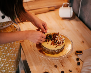 Chef Decorates Raw Vegan Cake with Nuts, Gingerbread and Orange
