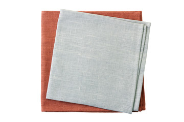 Stack of pale gray and brown napkins on white