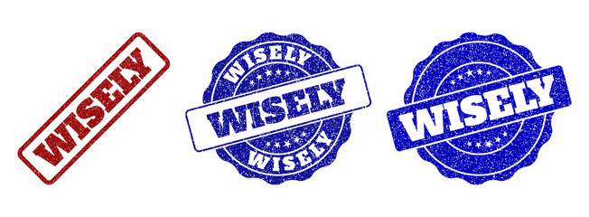 Obraz premium WISELY grunge stamp seals in red and blue colors. Vector WISELY labels with grainy texture. Graphic elements are rounded rectangles, rosettes, circles and text labels.