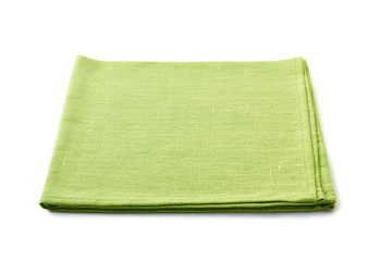Pale green folded textile napkin on white
