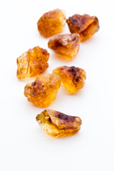 Brown caramelized sugar on white background.