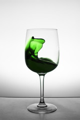 glass of green alcohol