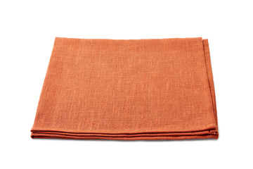 Folded orange textile napkin on white background