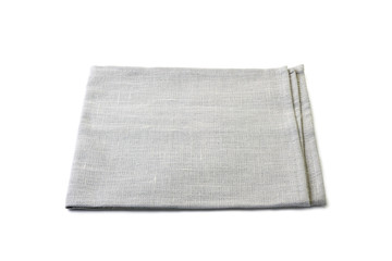 Folded pale gray textile napkin on white