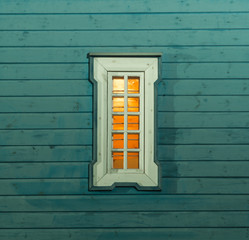 Small orthodox window. Poland. Wooden  window by night.	